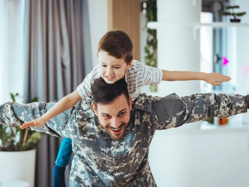 kid on the back of his father