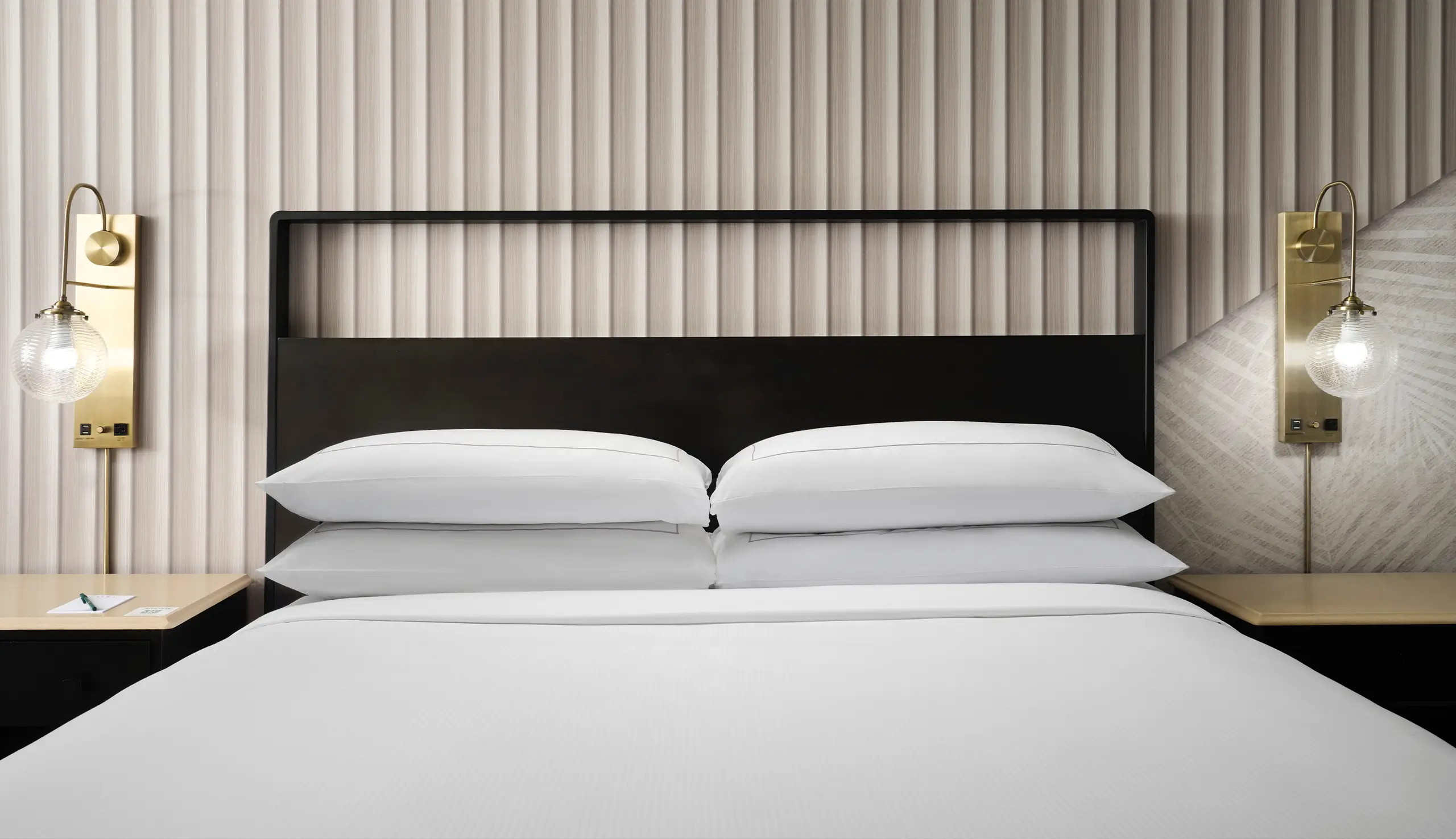 close up of king bed made up at hotel fera